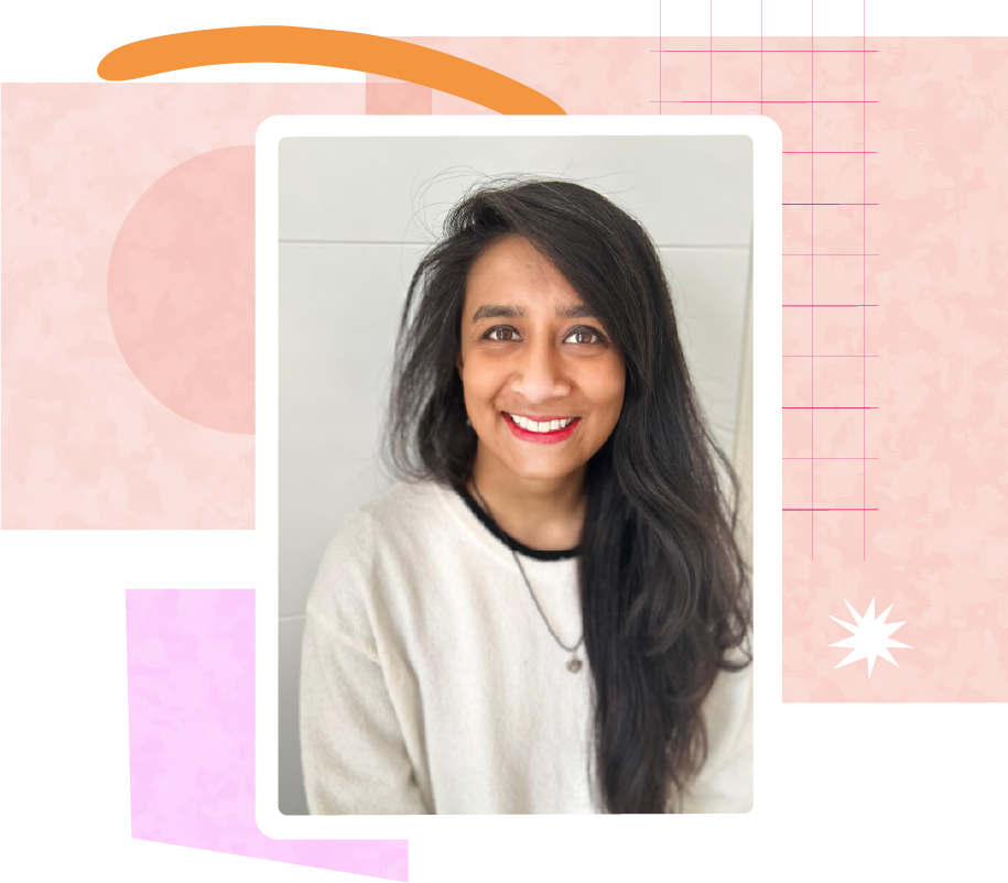 Madhuri Rahman has long, dark hair and wears a cream sweater with black trim and a pendant necklace.